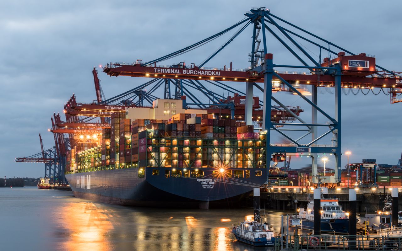 Home Container ships moored at Terminal Burchardkai in Hamburg, Germany during evening hours.