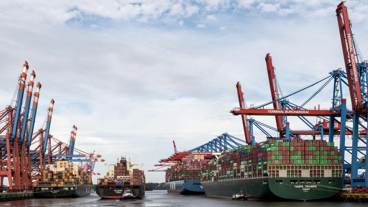 View of container ships docked at the busy Hamburg Port terminal in Germany.